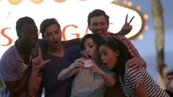 Friends take funny smartphone photos under classic Welcome To Las Vegas sign Stock Footage