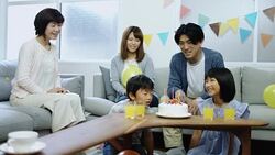 Family Gathered Around Birthday Cake Stock Footage