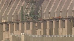 Construction workers move equipment along the Three Gorges Dam in China. Stock Footage