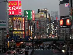City centre road traffic, trains and commuters, Shinjuku, Tokyo City centre, Japan, Asia Stock Footage