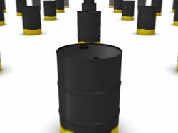 Dolly back diagonally from single Oil Drum (Black and Gold) revealing many Stock Footage