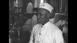 African-American chef cooks steaks on the Pennsylvania Railroad's new Congressional Line News Clip