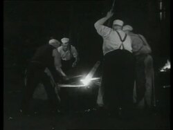 Manganese steel resists hard wear.  Tools used for heavy work are made of this alloy.  Steel workers, forge, UK 1939 Stock Footage