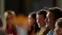 Bar owner chats with happy customer while bartender shakes cocktail shaker Stock Footage