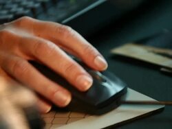Woman Using a Computer Mouse Stock Footage