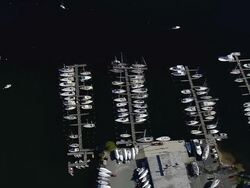 WS AERIAL ZI Shot of boat passing along with harbor at Mystic / Connecticut, United States Stock Footage