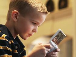 little boy plays a personal video game player  Stock Footage