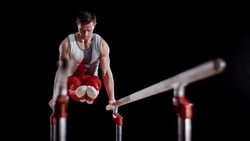 SLO MO LD Gymnast performing on parallel bars Stock Footage
