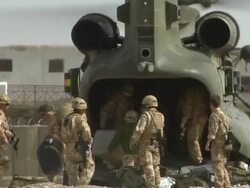 MS Group of soldiers carrying luggage from military helicopter / Musa Qala, Helmand Province, Afghanistan. Stock Footage