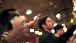 Guy at slot machine pulls lever and shoots for jackpot Stock Footage