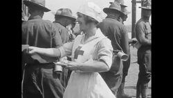 WWI, Red Cross woman handing out information at Red Cross Canteen Service Stock Footage