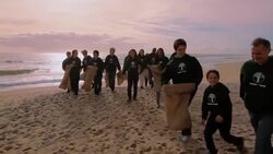 Volunteers walking from shore Stock Footage