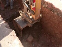MS Shot of workmen Engraving on street for works at sewage pipe / Saarburg, Rhineland Palatinate, Germany Stock Footage