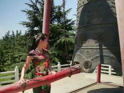 MS Shot of girl ringing bell / Xian, Shaanxi, China Stock Footage