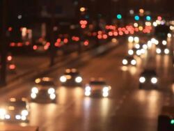 Defocused of traffic light on highway in the dark night Stock Footage