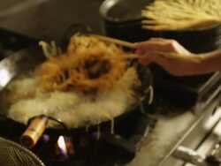 MS R/F Prawn dish preparation at a kitchen grating potato / Sao Paulo, Brazil Stock Footage