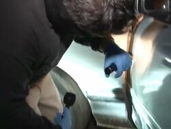 MS ZI TD TU PAN Shot of Mexican CSI examine in car AUDIO / Ciudad Juarez, Juarez, Mexico Stock Footage