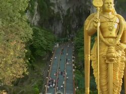 ZO Staircase and Hindu deity Murugan outside Batu Caves / Kuala Lumpur, Malaysia Stock Footage