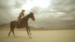 (Slow Motion) Riding Horses in the Dessert 05 Stock Footage