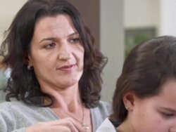 HD: Mother Combing Her Daughter's Hair Stock Footage