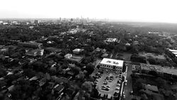 Monochrome Black and white Austin Texas Ominous ATX Aerial View Moving away from City Stock Footage