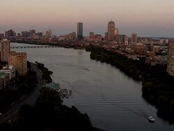 AERIAL, Charles river and Boston downtown buildings at sunset, Massachusetts, USA Stock Footage