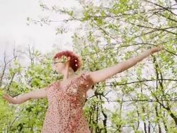 SLO MO Ecstatic woman dancing under the falling petals Stock Footage
