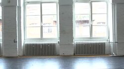 Young female ballet dancer doing a split in rehearsal room Stock Footage