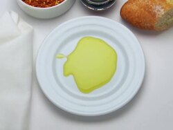 MS Shot of olive oil pouring on plate / Spain Stock Footage