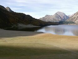 WS AERIAL View of village of Isola on isola delta at lake sils / Isola, Upper Engadin, Switzerland Stock Footage
