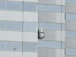 MS Window cleaner on building cleaning window / Tokyo, Tokyo-to, Japan Stock Footage