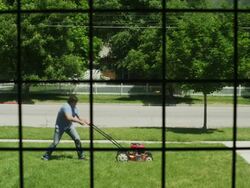 WS Man struggling with lawnmower / Provo, Utah, USA Stock Footage