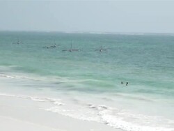 ZO People on beach at south coast of Mombasa AUDIO / Mombasa, Coast Province, Kenya Stock Footage