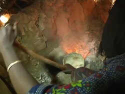 Woman stirring pastry of Ethiopian dish Stock Footage