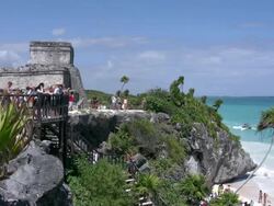 Mayan ruins walkway tourists at Tulum ocean view Stock Footage