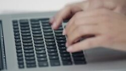 Woman typing on laptop Stock Footage