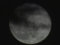 MS CU Full moon rising in sky at night / Lake Bogoria, Kenya Stock Footage