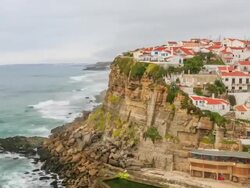 Time lapse:Azenhas do Mar village at dusk with stormy sea and dark clouds, Sintra Portugal Stock Footage