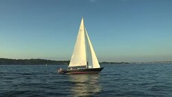 Two teenage boys sail across Narragansett Bay on a Morris M29 daysailer. Stock Footage