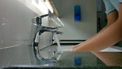 Washing hands under faucet Stock Footage