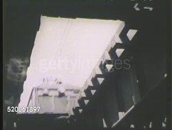 1942: JAPAN: RAILROADS: HA WS Electric passenger train passing through on railroad tracks. LA MS Train passing over. VS Train passing each other on tracks along canal, crossing bridge w/ automobiles. Transportation, traveling Instructional Video