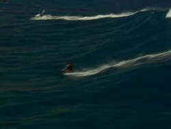 A personal water craft pulls a water skier over large waves. Stock Footage