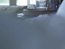 hotel resort getaway lodge bedroom bed sheets bedside table water glasses water bottle icebucket Stock Footage