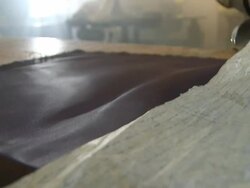 CU Shot of fabric being cut with scissors / South Africa Stock Footage