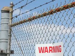 Secured area with fence and razor wire. Stock Footage
