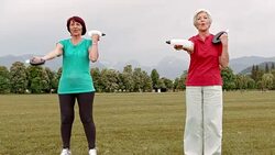 DS Senior women doing hand weight exercises in park Stock Footage