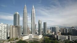 A bridge connects the two towers of the Petronas Twin Towers in the Kuala Lumpur City Center. Stock Footage