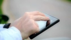 Using Tablet at the Outside Stock Footage