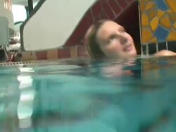 Blond girl relaxing herself in the hot thermal water Stock Footage