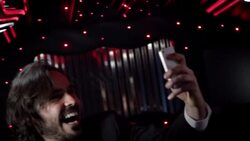 Celebrity poses for selfie in backseat of limousine and snaps photos of paparazzi outside at awards show Stock Footage